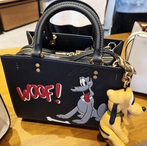 Disney x Coach Rogue Bag featuring the character Pluto. Without The Pluto Charm